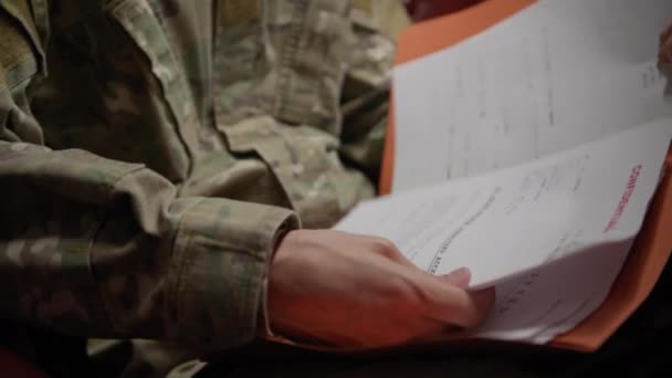 Soldier Consults Documents Contained Folder — Stock Video