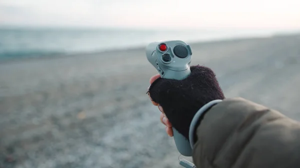Man Pilot Drone Remote Single Hand Controller Beach Ocean — Stockfoto