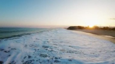 Mediterranean rough sea aerial view in Italy state during the sunset sky in March.