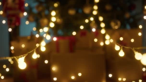Blurred Christmas Tree Lights Hanging Background — Stock Video