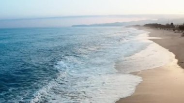 Mediterranean rough sea aerial view in Italy state during the sunset sky in March.