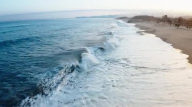 Mediterranean rough sea aerial view in Italy state during the sunset sky in March.