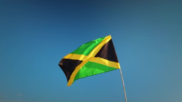 Jamaikan Lippu Liehuu Rantamajassa Lähellä Merta — kuvapankkivideo