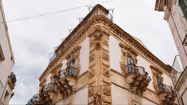 stock image Elegant and old building with balconies.