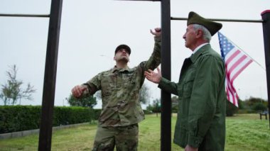 General Checks Physical Fitness Of Marines With Pull-ups.