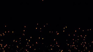 Alfa arka planında turuncu küçük ateş külleri yükseliyor.