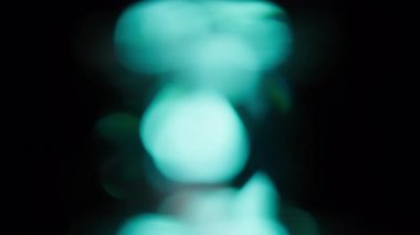 Bokeh of Light Sızıntı Turuncu ve Mavi Renkli Siyah Arkaplan