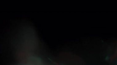 Yanıp sönen ışıklar Orange sızıntısı ve Teal Siyah Arkaplanda.