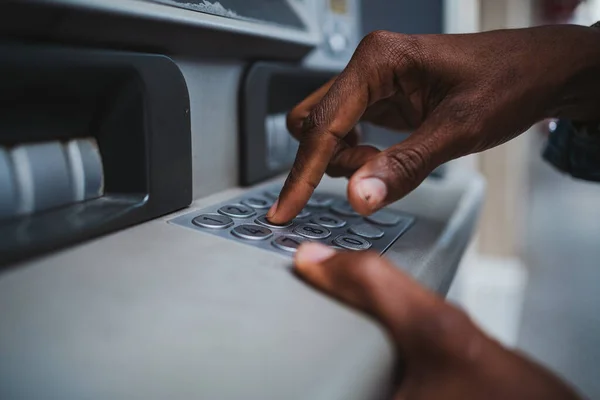 stock image Close up shot of a man typing his PIN code on a keyboard of a ATM to withdrawal money from bank