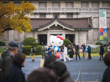 Tokyo, Japan- Nov 20, 2024 : Hello Kitty exhibition at Tokyo National Museum Ueno Mascot with people Japan Art event clipart