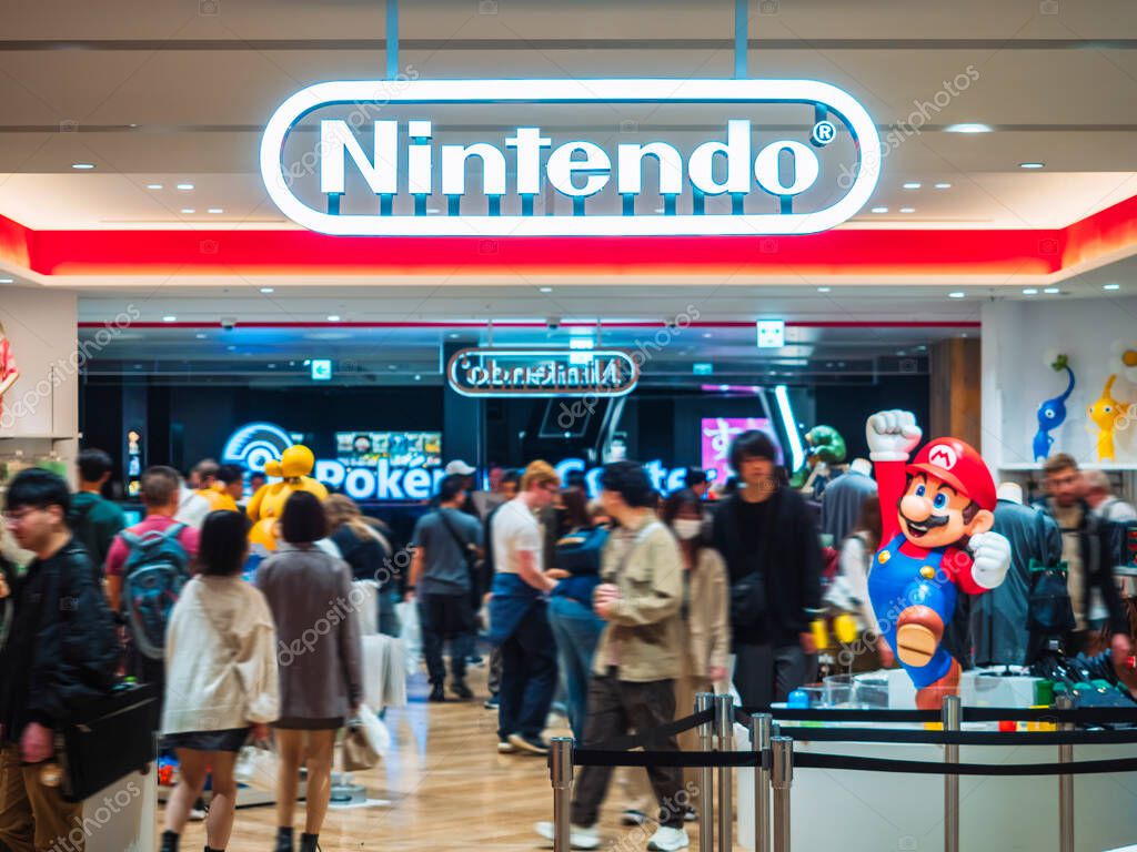 Nintendo Tokyo Shibuya front store logo with Mario mascot with crowd tourist : Tokyo, Japan- Nov 12, 2024