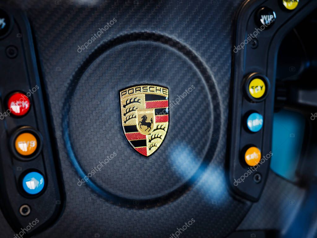 Porsche logo on car steering wheel Luxury car symbol German automobile : Bangkok, Thailand - Mar 28, 2025