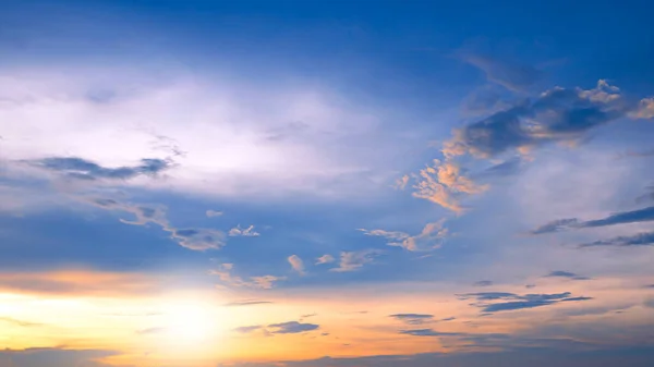 stock image Sunset sky clouds with yellow sunlight on blue sky background in evening time