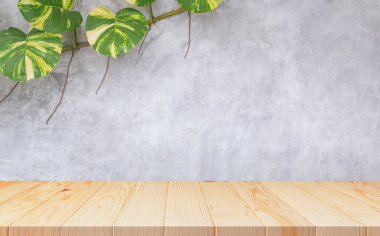 Empty wooden table with creeper plant growing on loft cement Wall Background, suitable for Product Display Presentation clipart