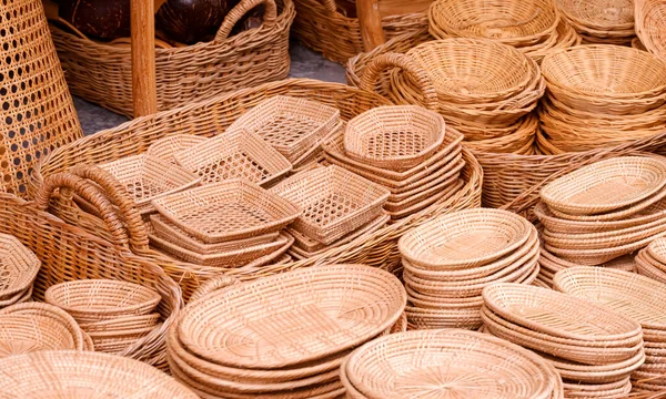 stock image Group of many various handmade wicker trays and baskets for sale in street market at Thailand