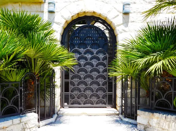 The front door of the building\'s lobby, which is located right on the seashore. Photo taken at a resort on the Adriatic Sea