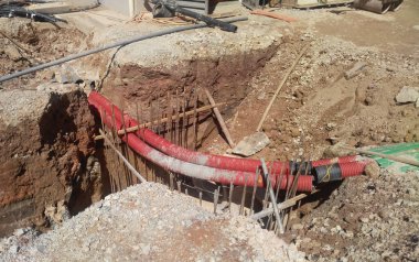 JOHOR, MALAYSIA -MARCH 02, 2017: Underground utility and services pipe lay by workers at the construction site. The pipes used to protect cable lay inside it.     clipart