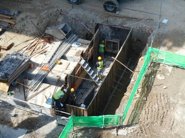 stock image JOHOR, MALAYSIA -JANUARY 12, 2017: Underground onsite detention pond under construction at the construction site.  It is using precast concrete U channel box culvert as the main structure. 