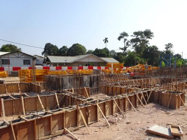 JOHOR, MALAYSIA -APRIL 06, 2016: Ground beam timber form work constructed by workers at the construction site. 