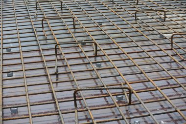 SELANGOR, MALAYSIA -MAY 13, 2016: Hot rolled deformed steel bars or steel reinforcement bar used at construction site to strengthen concrete. It is shaped follow the engineer design.