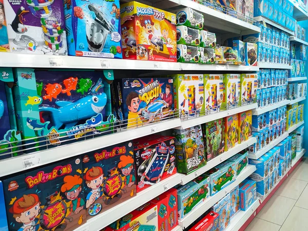 stock image JOHOR, MALAYSIA -JULY 24, 2022: Children's toys are hung and displayed for sale. Toys are made in colorful colors and various designs to attract children's interest. Has a price tag.