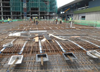 PERAK, MALAYSIA -APRIL 12, 2016: Floor slab reinforcement bar with post tension cable tendon on timber form work at the construction site in Perak, Malaysia