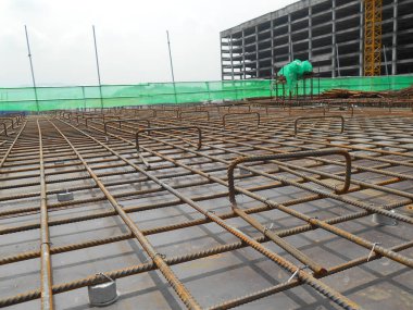 SELANGOR, MALAYSIA -MAY 13, 2016: Hot rolled deformed steel bars or steel reinforcement bar used at construction site to strengthen concrete. It is shaped follow the engineer design.