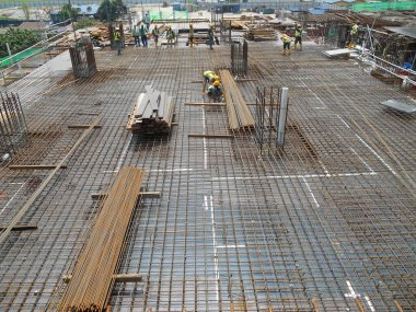 SELANGOR, MALAYSIA -MAY 13, 2016: Hot rolled deformed steel bars or steel reinforcement bar used at construction site to strengthen concrete. It is shaped follow the engineer design.
