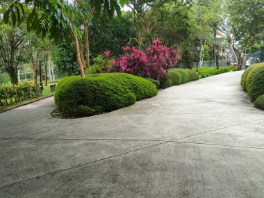 KUALA LUMPUR, MALAYSIA -JULY 6, 2022: Pedestrian path in a public park. Providing comfort for the public to stroll or have fun in the public park. Comfortable and spacious.