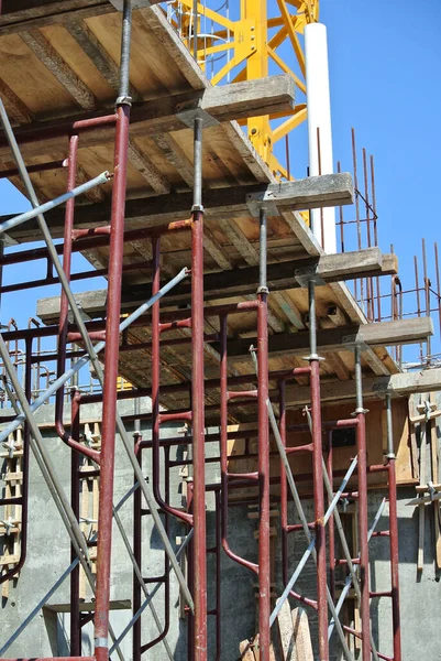 PERAK, MALAYSIA -APRIL 10, 2016: Construction workers fabricating timber form work made from plywood at the construction site in Perak, Malaysia.  