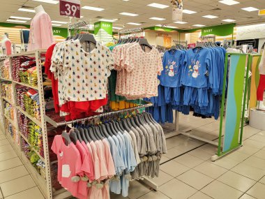 KUALA LUMPUR, MALAYSIA -JANUARY 9, 2023: Various types of children's clothes are hung and displayed for sale. Separated by type and fashion. Have a price tag for customer reference.