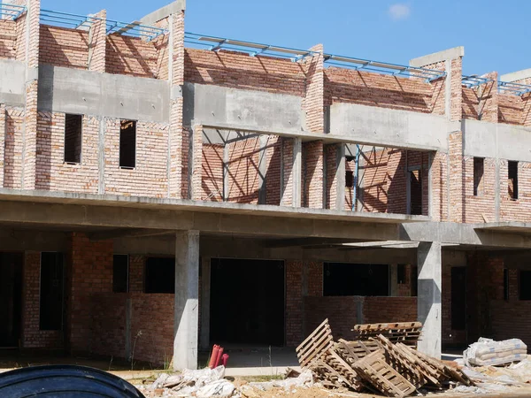 stock image SEREMBAN, MALAYSIA -JUNE 17, 2021: New double-story terrace house under construction in Malaysia. Designed by an architect with a modern and contemporary style. Almost completed.  