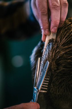 Barbershop, close-up of cutting hair. Vintage style. High quality photo