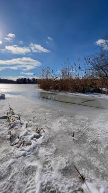 Scenery landscape background with lake and clouds on a sunny day