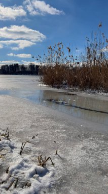 Scenery landscape background with lake and clouds on a sunny day
