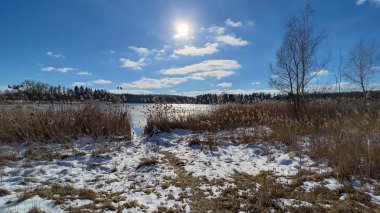 Scenery landscape background with lake and clouds on a sunny day