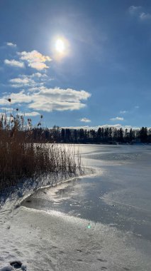 Scenery landscape background with lake and clouds on a sunny day