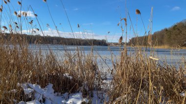 Scenery landscape background with lake and clouds on a sunny day