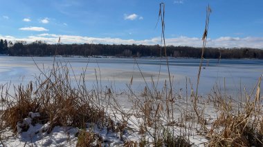Scenery landscape background with lake and clouds on a sunny day