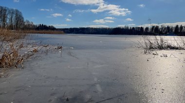 Scenery landscape background with lake and clouds on a sunny day