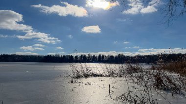 Scenery landscape background with lake and clouds on a sunny day