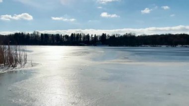 Scenery landscape background with lake and clouds on a sunny day