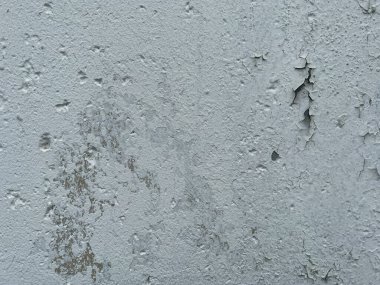 old cracked paint on wall background in grunge style