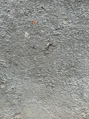 old cracked paint on wall background in grunge style