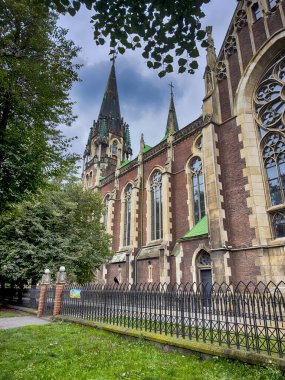 Neo Gothic Polish cathedral Olga and Elizabeth in Lviv city spires under dramatic skies