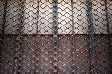 Iron curtain background on a facade
