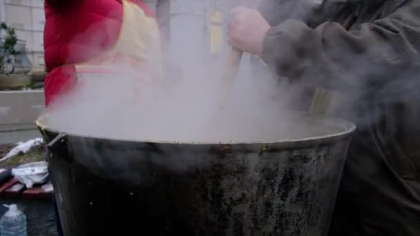 Man Stirs Food Street Large Wooden Spoon Large Vat High — Stock Video