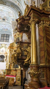 Golden statues and columns in an ancient 12th-century church in Poland. High quality photo