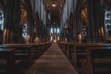 Majestic hall, benches and ceiling of the ancient Gothic cathedral in Nuremberg, Germany. High quality photo