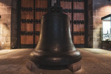 Ancient bell in the Gothic Catholic Cathedral of Nuremberg, Germany. High quality photo